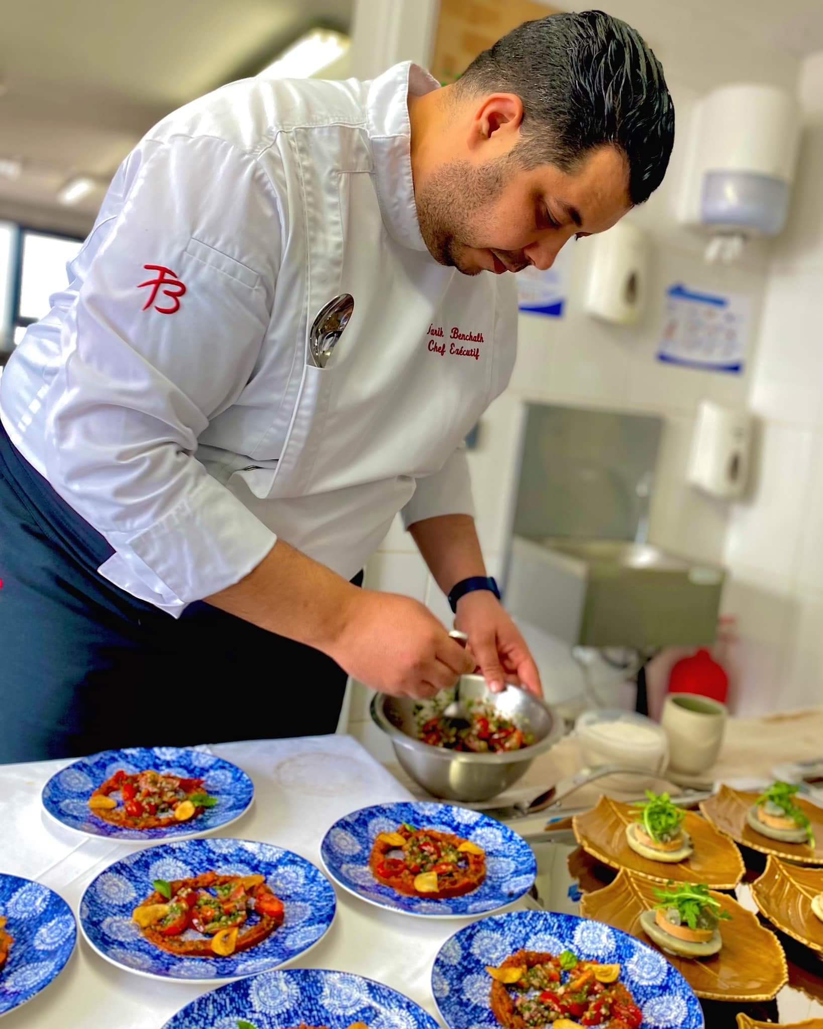 Chef Tarik presenting a completed dish
